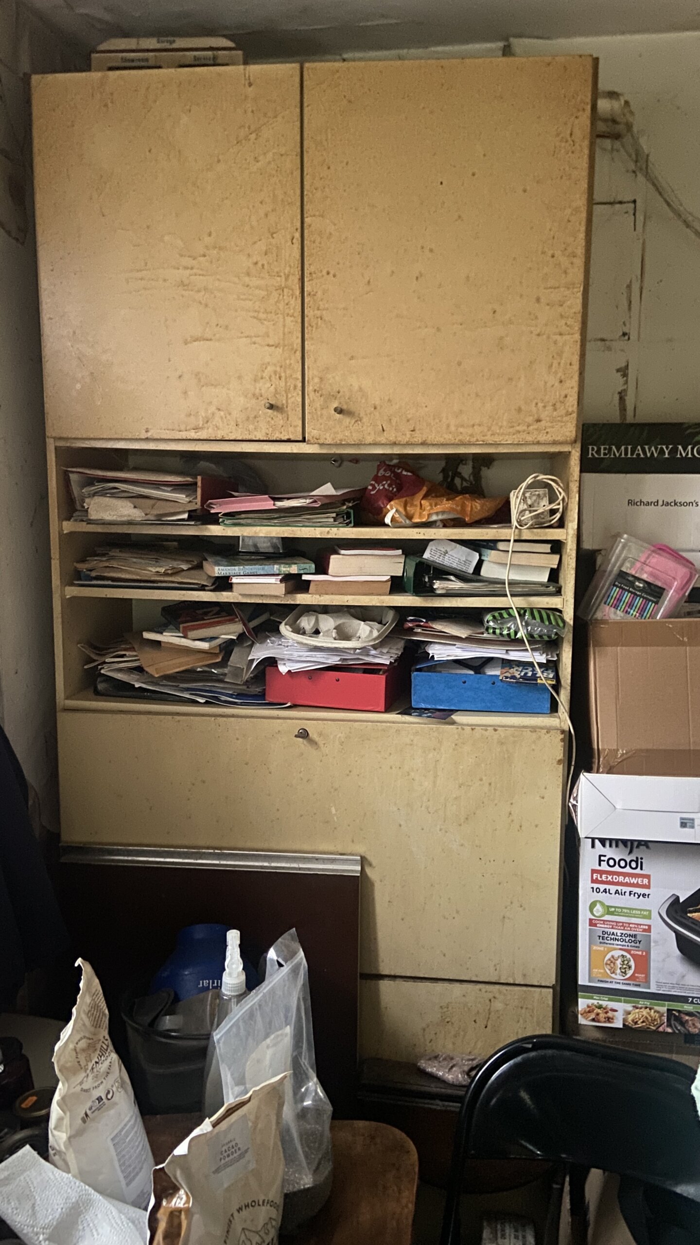 Before hoarding house clearance in a cluttered room